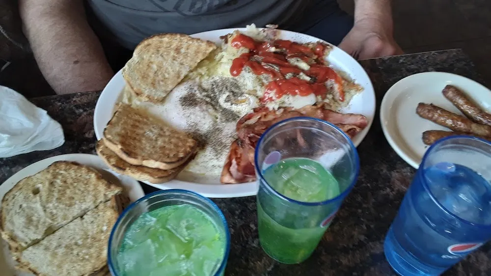 4 Eggs over Easy Hashbrowns and Toast